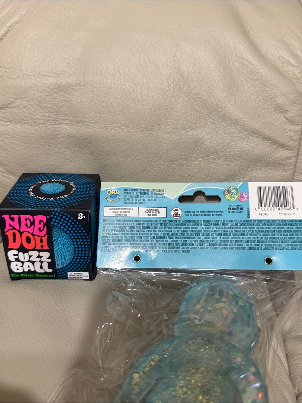 NeeDoh Blue Fuzz Ball Velvet Squeeze & ORB Toys Sugar Swaps Onsie Baby in Blue